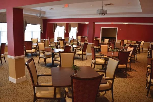 Interior view of a dining room with tables and chairs