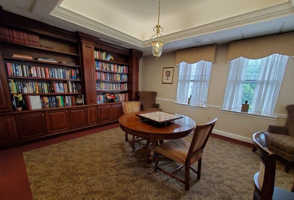 Cozy library area with bookshelf and table