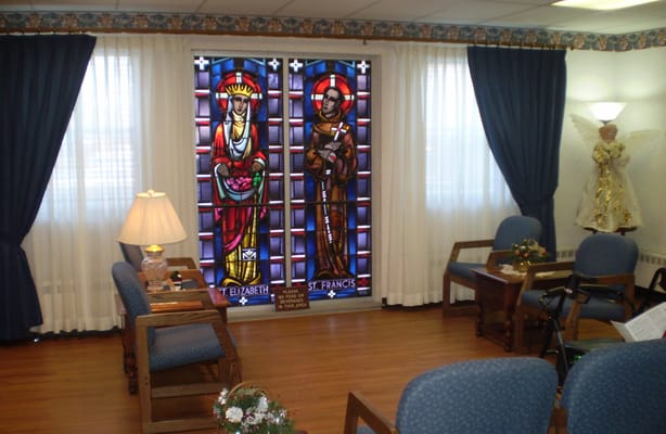 Common area with stained glass windows and seating