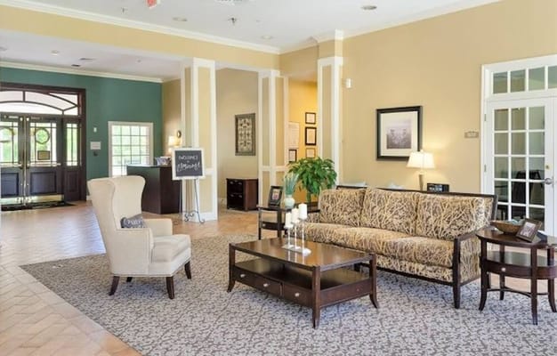 Cozy lobby area with seating and welcome sign