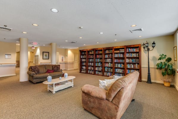Common area with seating and bookshelves