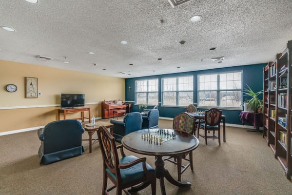 Interior common area with seating and game tables