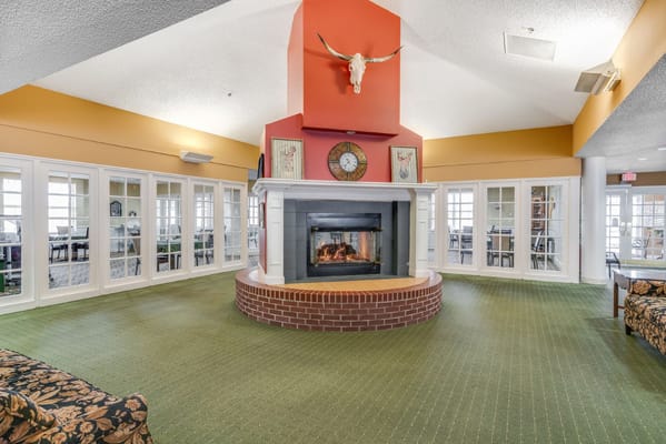 Cozy common area with a fireplace and seating