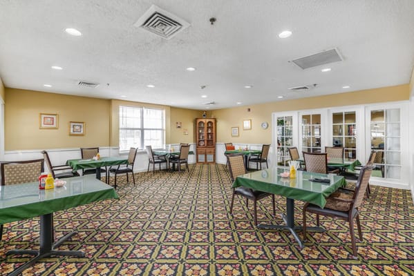 Dining area with tables and decor inside the facility