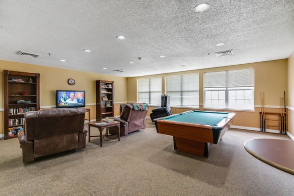 Interior common area with seating and a pool table