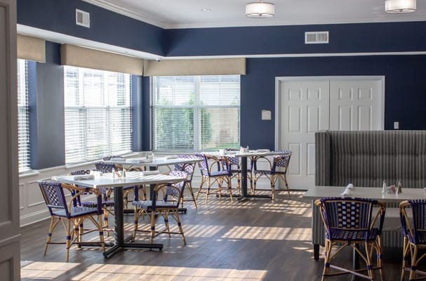 Bright dining room with tables and chairs