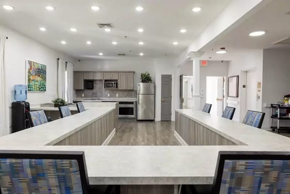 Modern kitchen with an island and seating at SummerHouse Park Provence