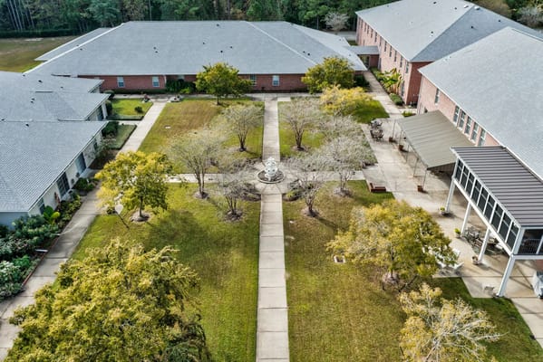 Aerial view of a landscaped courtyard with a fountain and seating areas.