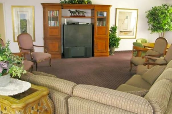 Cozy common area with seating and entertainment center