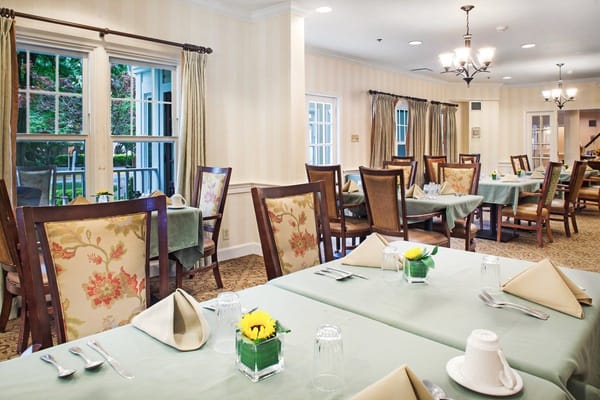 Dining room setup with tables and chairs