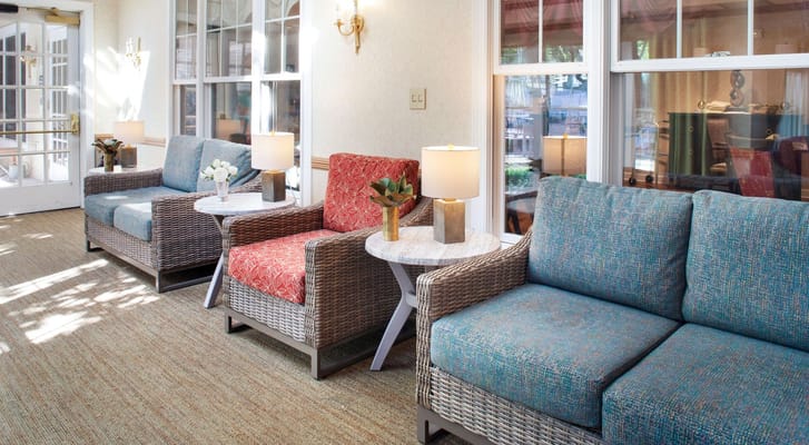 Cozy living room area with colorful seating and natural light