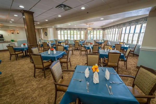 Dining area with tables set for residents