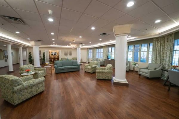 Bright common area with seating and natural light