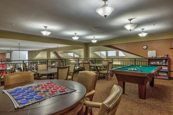 Interior common area with pool table and seating