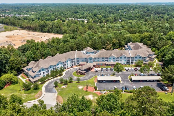 Aerial view of TerraBella Riverplace surrounded by greenery