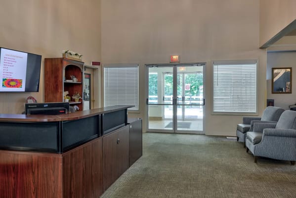 Interior view of the reception area with a desk and chairs