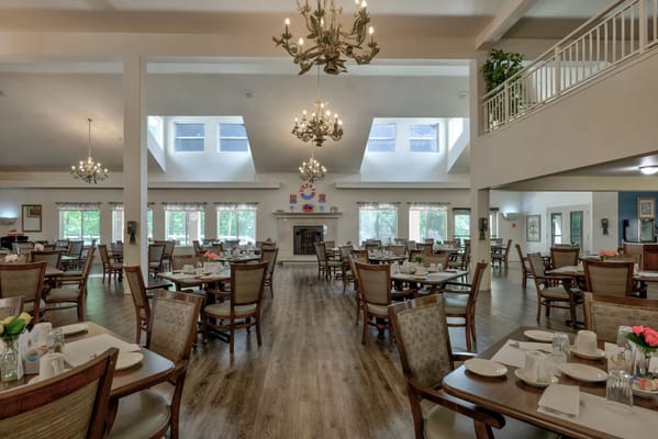 Spacious dining area with tables set for mealtime