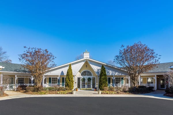 Front entrance of a assisted living facility with landscaping