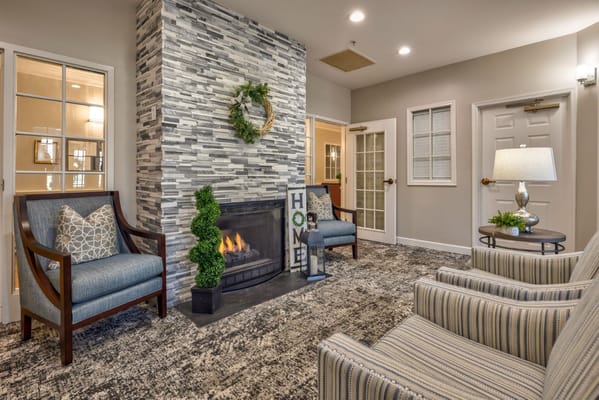 Interior common area with fireplace and seating