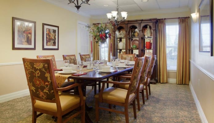 Bright dining room with a large table set