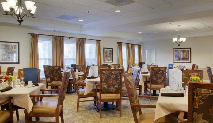 Dining room setup with tables and chairs