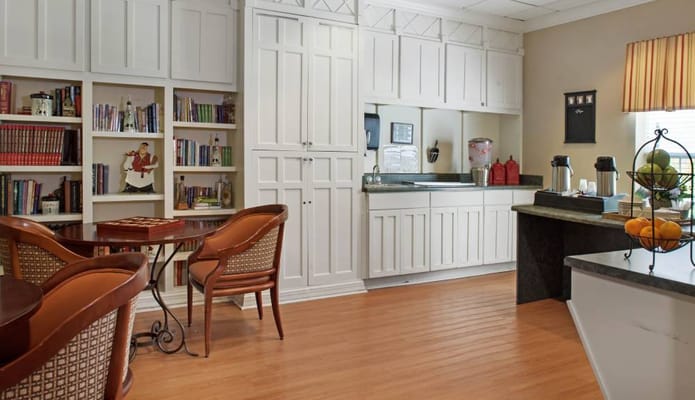 Bright common area with bookshelves and seating