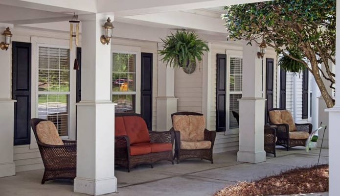 Outdoor seating area with comfortable chairs and plants