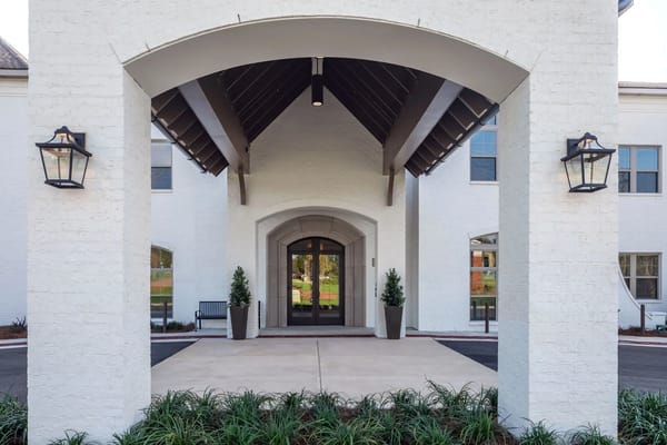 Entrance of a senior living facility with architectural features