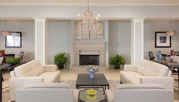 Bright common area with couches and plants