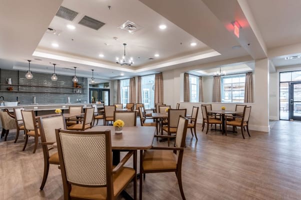 Bright dining area with tables and chairs