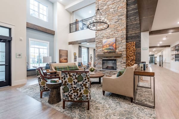 Bright and inviting lobby with seating area and fireplace