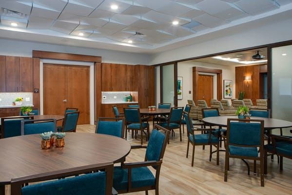 Bright interior common area with tables and chairs