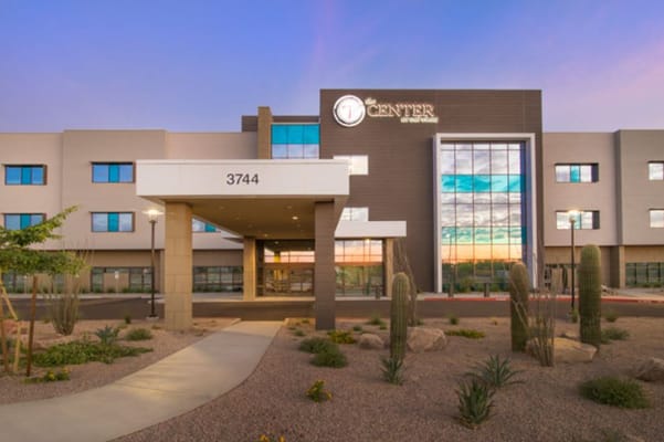 Main entrance of The Center at Val Vista with landscaping