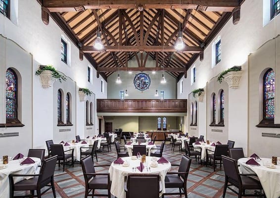 Elegant dining room with tables set for a meal
