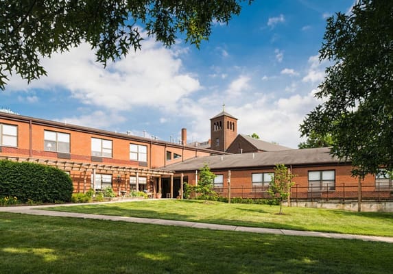 A view of The Clare Estate showcasing the building and garden area.