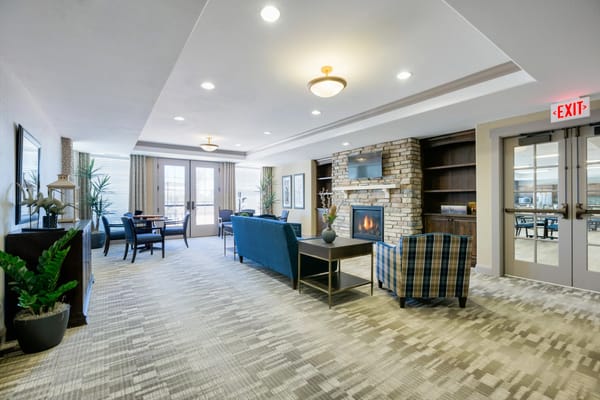 Comfortable lounge area with seating and a fireplace