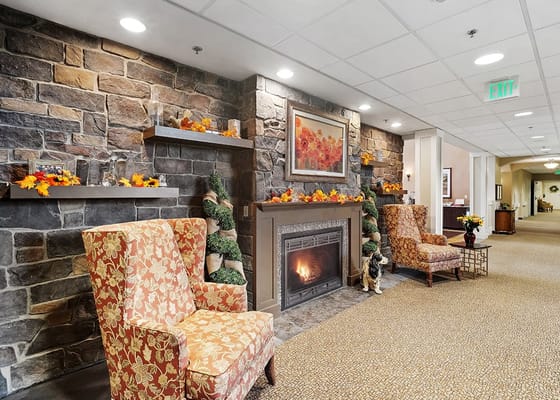 Cozy lobby area with a fireplace and seating