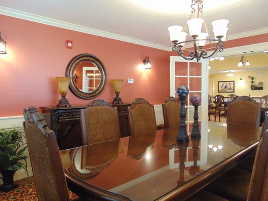 Elegant dining room with a large table and chandelier