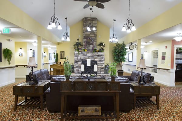 Common area with seating and a stone fireplace
