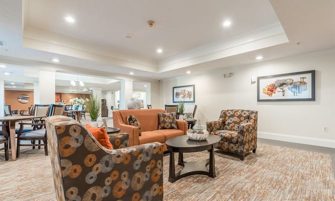 Cozy seating area with multi-colored chairs and a coffee table in the lounge.