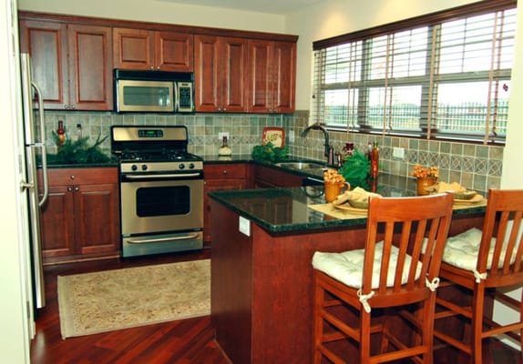 Modern kitchen interior with wooden cabinets and appliances