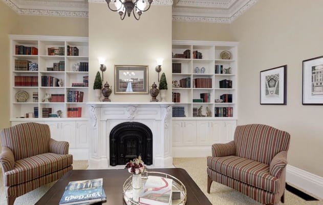 Cozy interior with bookshelves and armchairs