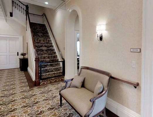 A cozy interior sitting area with a staircase