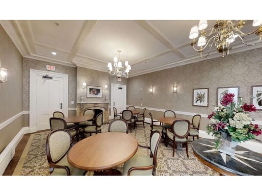 Interior view of a common area with tables and chairs