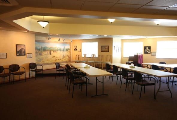 Common area with tables and chairs for activities
