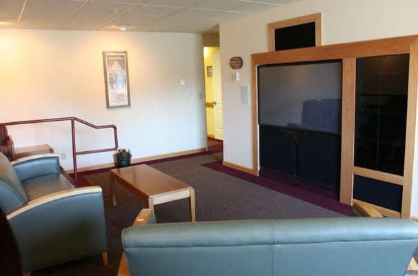 Common area with seating and a television