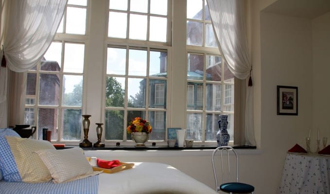 A gated courtyard garden with vibrant flowers and greenery at Lorelton.