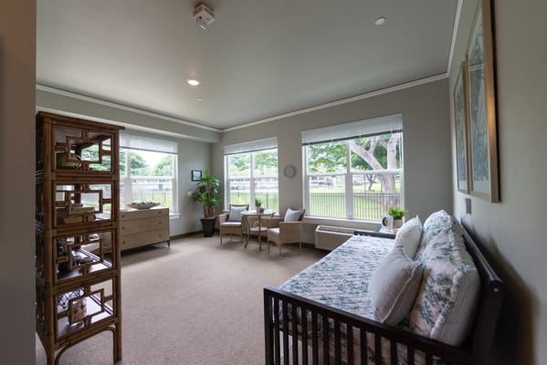 Bright and inviting room with plants and seating areas
