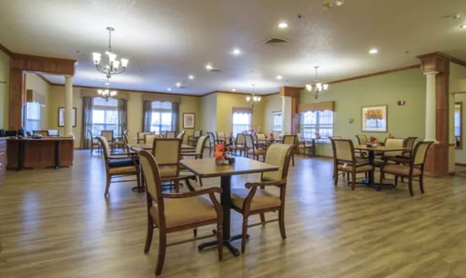 Dining room with tables and chairs in a well-lit interior