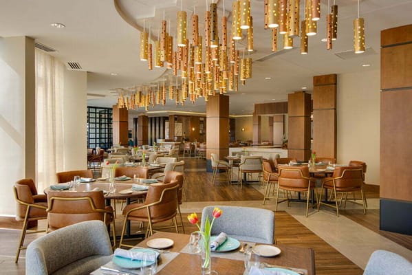 Modern dining room with stylish lighting and seating